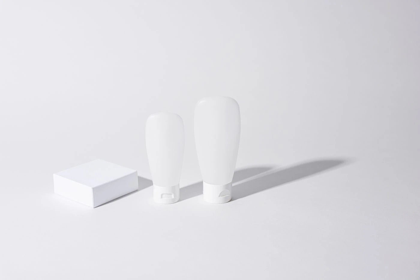 White Containers on White Surface · Free Stock Photo — illustrative context