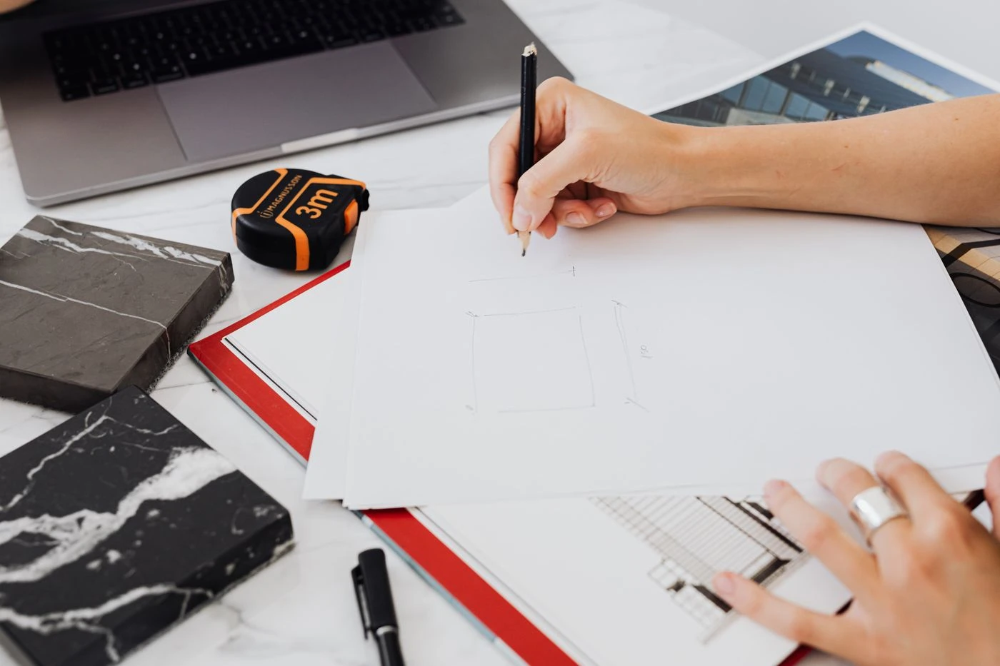 Architect drafting a blueprint — illustrative context