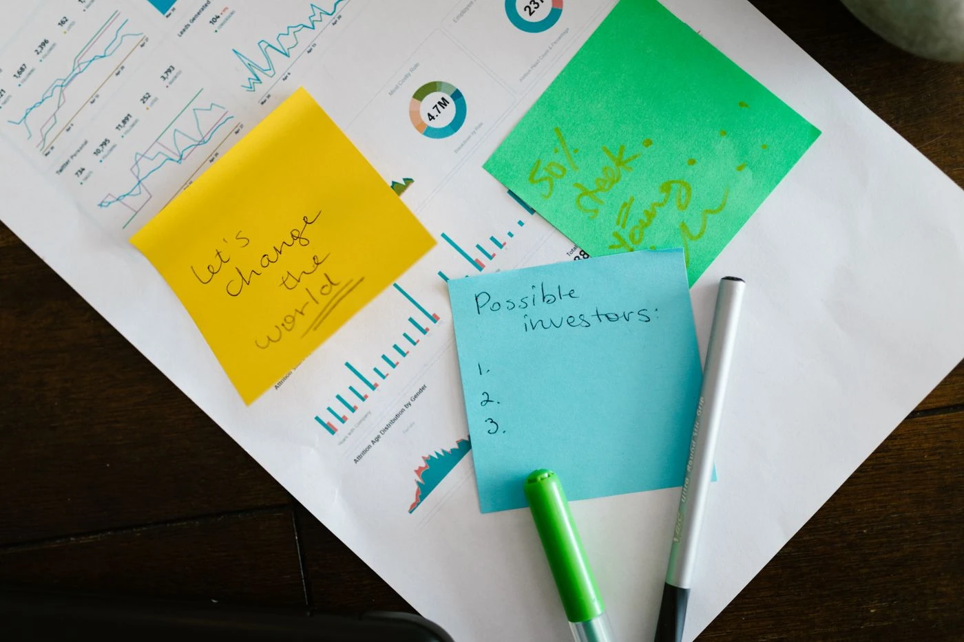 Stick Pads Notes over Business Data Printout · Free Stock Photo — illustrative context