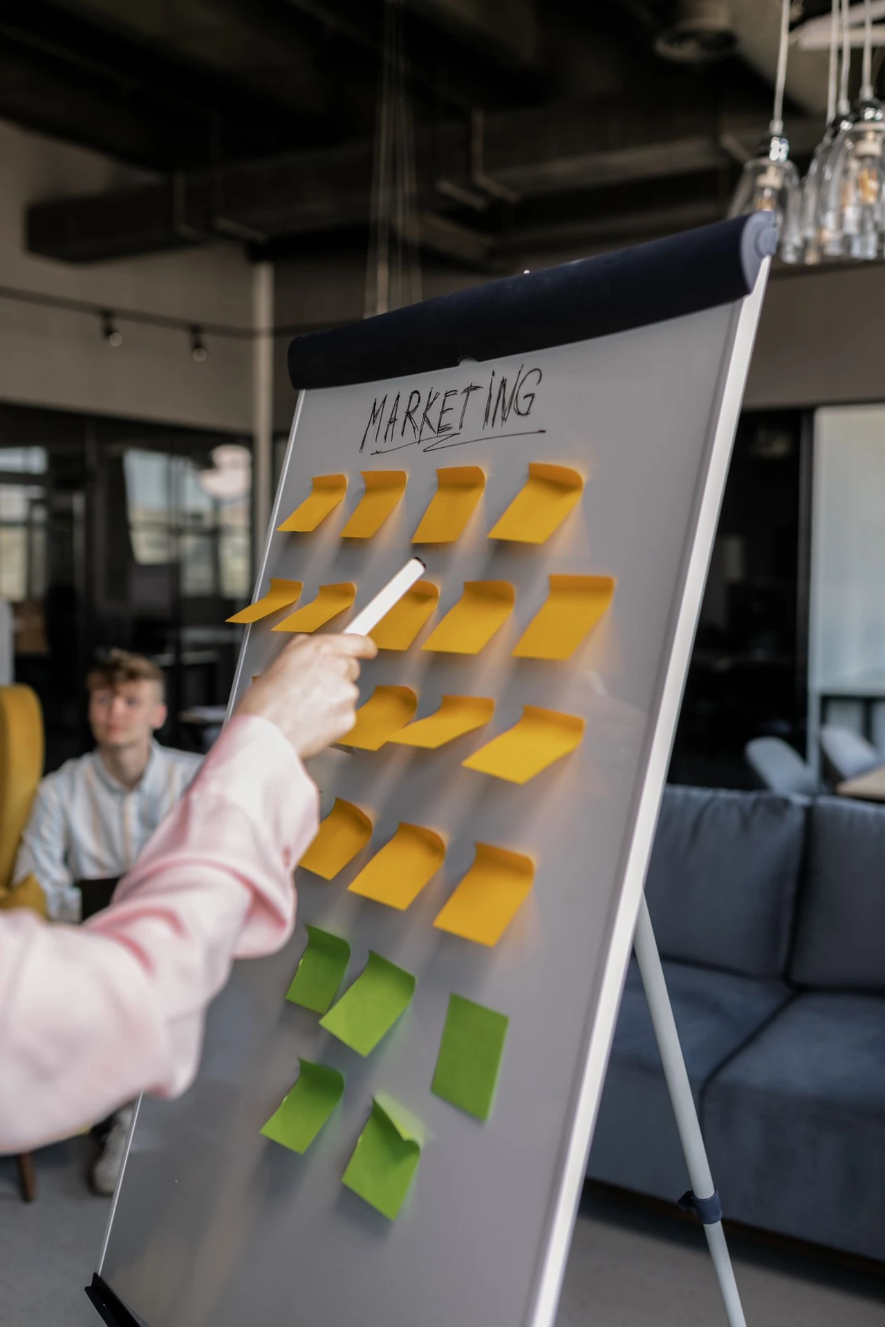 A Person Pointing at a Whiteboard while Holding a Pen · Free Stock Photo — illustrative context