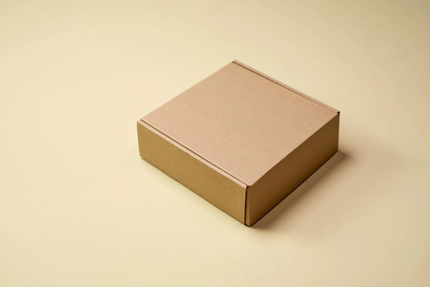 Brown Cardboard Box on White Table · Free Stock Photo — illustrative context