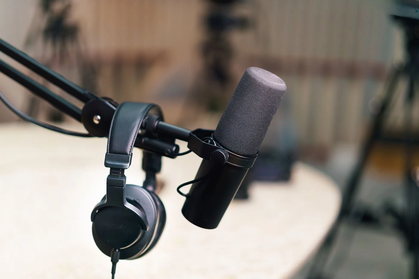 Podcast microphone and headphones — illustrative context