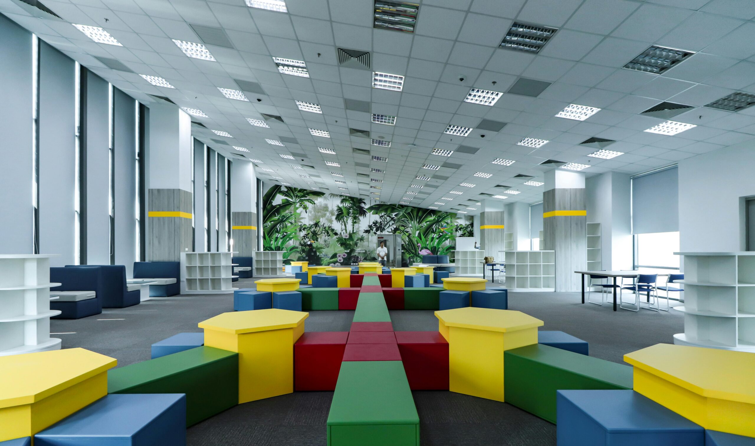 Spacious modern educational area with vibrant furniture in a well-lit environment.